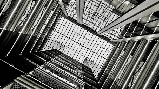 istock Black-and-White Perspective of the Office Lobby's Architectural View from a Low Angle 1656280674