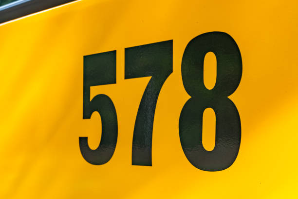 istock Back of a parked yellow school bus number 578 1656282273