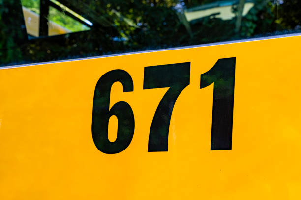 istock Back of a parked yellow school bus number 671 1656283327