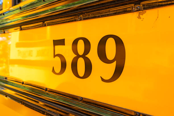 istock Side of a parked yellow school bus number 589 1656286565