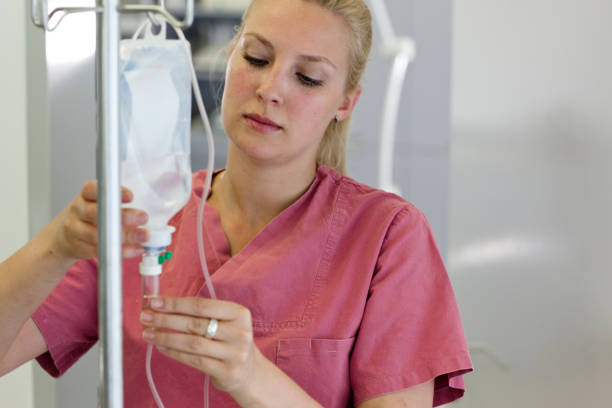 istock A female nurse preparing an infusion 165630252