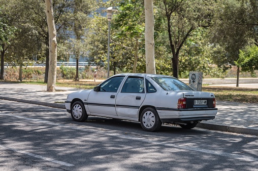 Barcelona, Spain – April 15, 2023: An old Opel Vectra A saloon car, generation from 1988 to 1995 parked on the street
