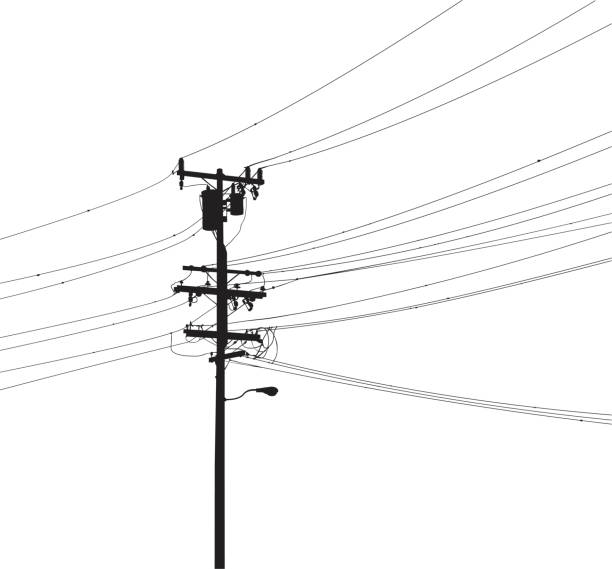 Utility pole silhouette Detailed utility pole silhouette with street light, transformers and cables.  single line power isolated electricity stock illustrations