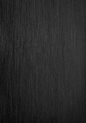 Vertical background of black brushed steel.