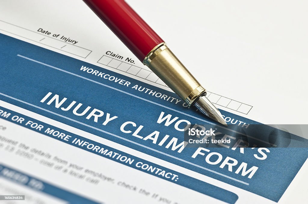 Trabajador de la lesión formulario de reclamación - Foto de stock de Cuaderno de apuntes libre de derechos
