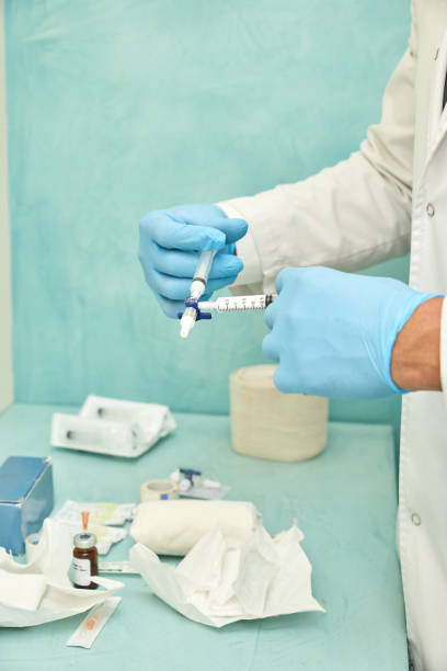 istock Anonymous doctor preparing a vaccination in a clinic 1656386632
