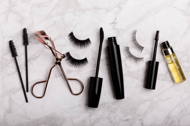 istock Composition with false eyelashes, mascara and eyelash brushes, eyelash curlers on a background. Makeup artist tools. Beauty concept. Makeup. Place for text. Place for copying. Flatley. MOCAP. 1656387154