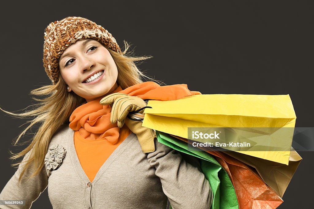 Happy girl holding shopping bags Cheerful girl with shopping bags 16-17 Years Stock Photo