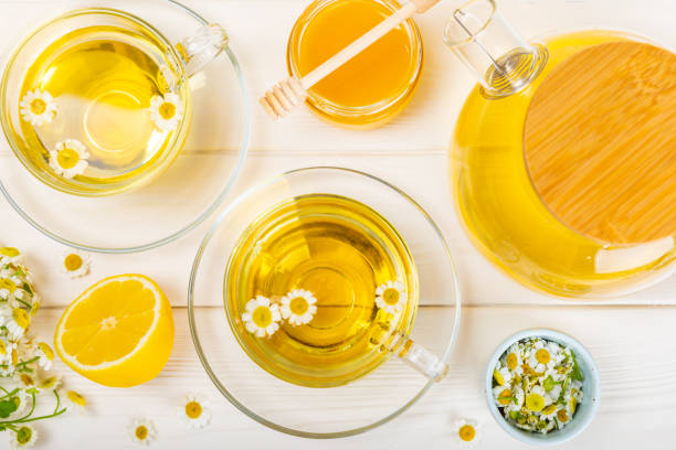 istock Chamomile tea in a  cup on a  texture background. Natural hour with chamomile flowers. Herbal tea. Immunity tea.Natural healer concept. Healthy detox drink.Close up. Place for text. 1656410667