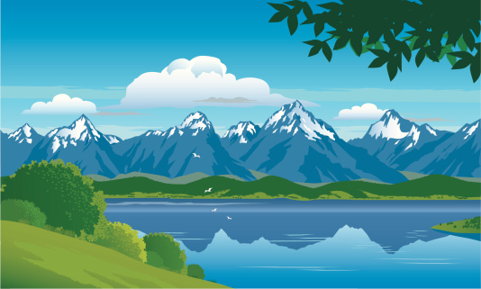 Snow capped mountains with forest, hills and lake with a background of blue sky and clouds. Art on easily edited layers.