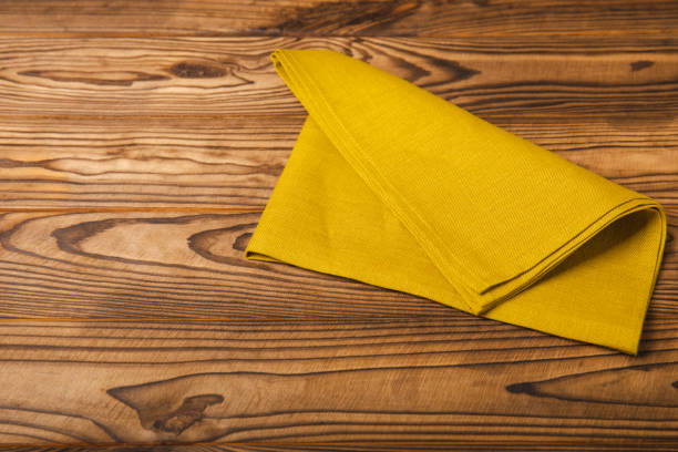 istock Kitchen towel on a  textured background. Kitchen utensils and textile napkin. A stack of cotton towels on the table. Home decor. Tablecloth for the table. Copy space for text. Mockup for design. 1656423427