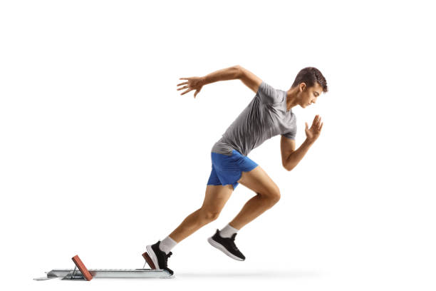 istock Full length profile shot of a guy beginning a race from start blocks 1656423905