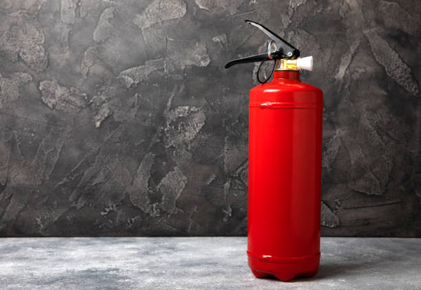 istock Fire extinguisher on a  background. Fire protection, home fire extinguisher. home security concept. Place for text. Copy space.banner 1656425064