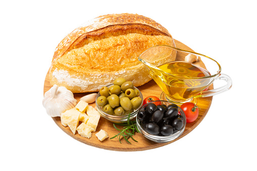 Bruschetta with olive oil, olives, pesto, garlic and parmesan isolated on white background. ciabatta bread with olive oil and spices. Delicacy. Delicious and healthy food. Vegan.