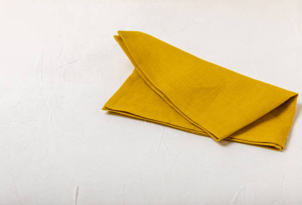 istock Kitchen towel on a  textured background. Kitchen utensils and textile napkin. A stack of cotton towels on the table. Home decor. Tablecloth for the table. Copy space for text. Mockup for design. 1656447486