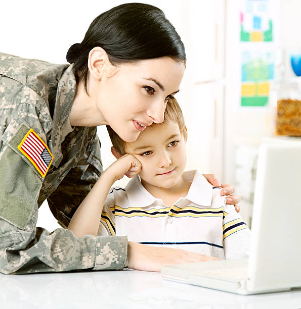 istock Female American Soldier with Son 165646152