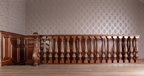 Home interior staircase with wooden balusters in brown color