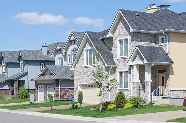 Newly built homes with attached garages and driveways stock photo