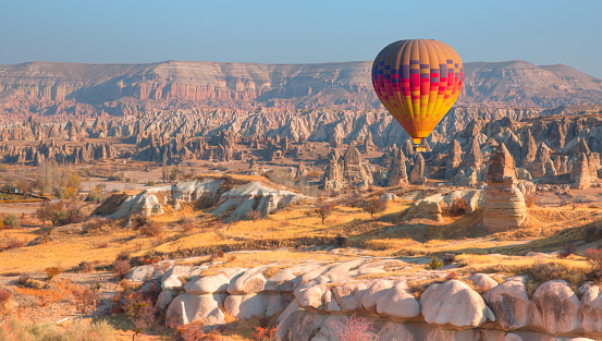 Hot air balloon flying over spectacular Cappadocia - Goreme, Turkey