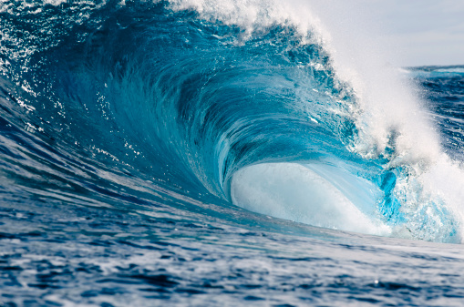 Looking into a huge powerful blue wave.
