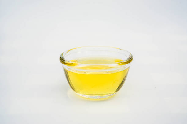istock Almond oil with almond grains, white background 1656477537