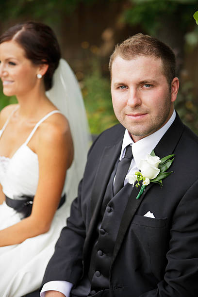 istock Wedding Couple Sitting Outdoors 165648243