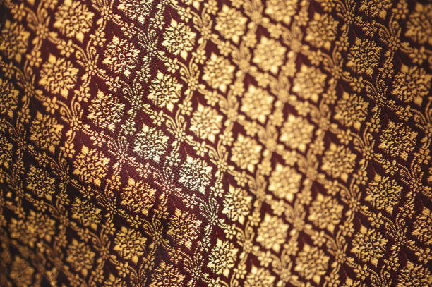 A close-up texture of a classic floral print with small pink, purple, and white flowers. Suitable for textiles and backgrounds.
