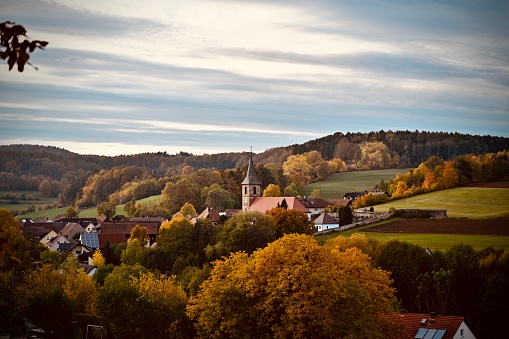 small village in fall forest