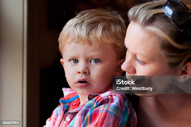 Blond Mother And Son Sitting At Window Stock Photo - Download Image Now - Child, Mother, Looking Through Window