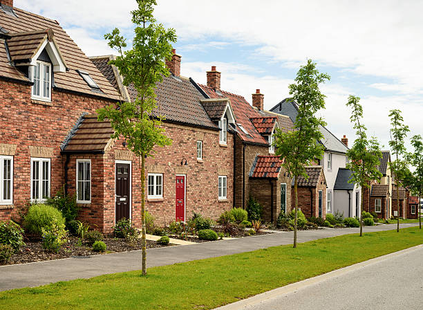 Row of Modern Houses Modern brick houses, built to traditional designs on a housing development in Northern England. yorkshire england photos stock pictures, royalty-free photos & images