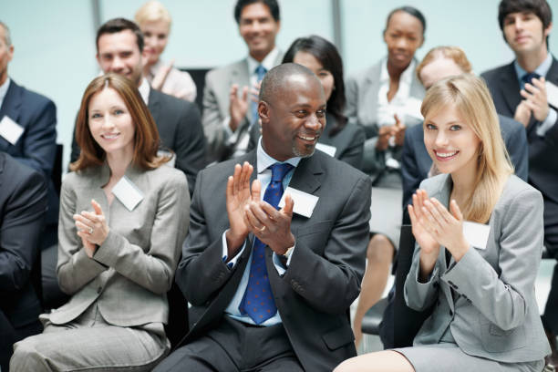 istock Corporate people applauding during seminar 165652444