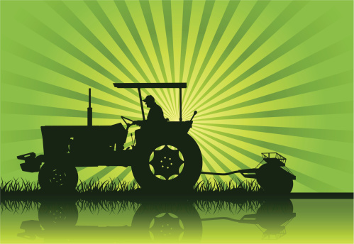 A tractor in silhouette on a farm. Hi-res Jpeg included..