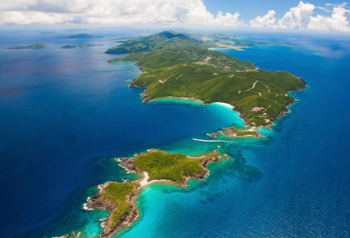 aerial shot of West End, St. Thomas in US Virgin Islands in the foregound, St. John, USVI and Tortola, BVI on the horizon
