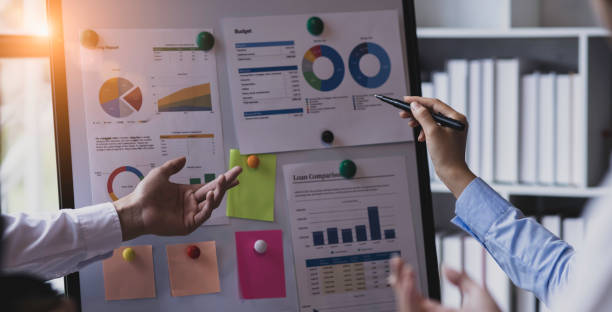 istock Group of  business hands with business financial documents. 1656549297