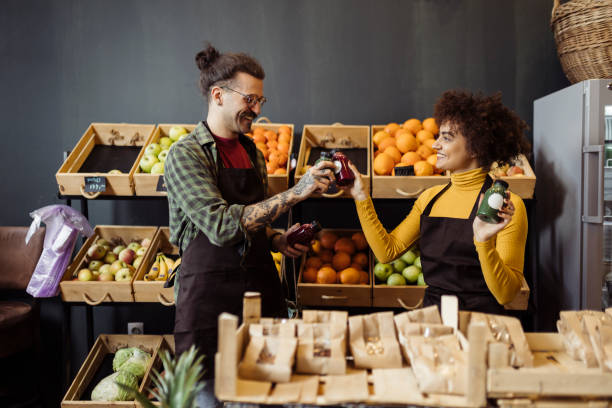 istock Two salespeople working in grocery shop 1656563760