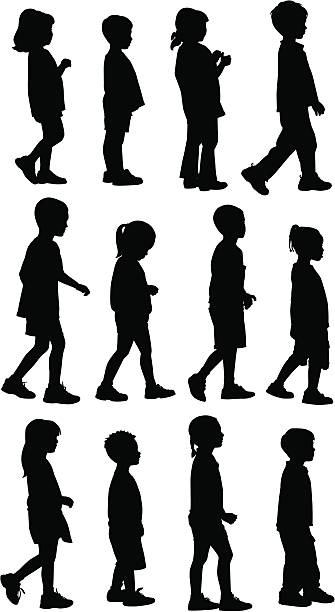 Silhouettes of small children walking on a white background vector art illustration