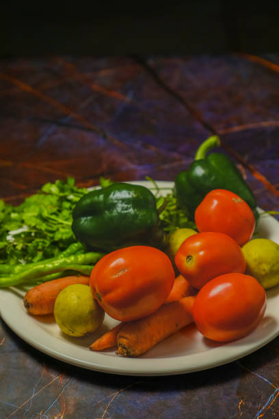 istock A white plate with pickled tomatoes, lemon, carrot and other vegetables 1656592188