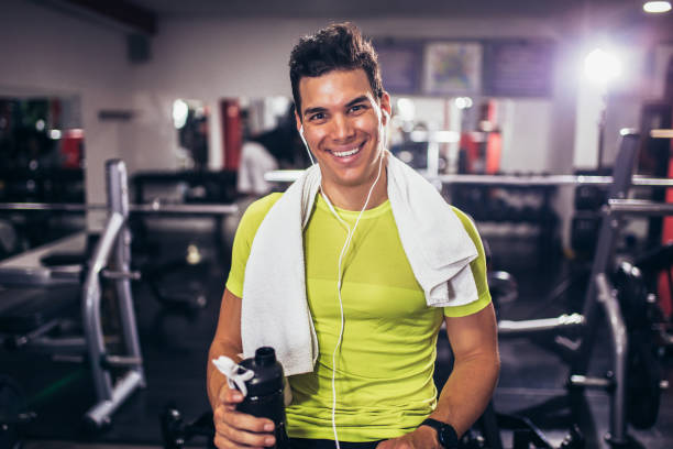istock Handsome sporty man resting, having break drinking water after doing exercise 1656596996