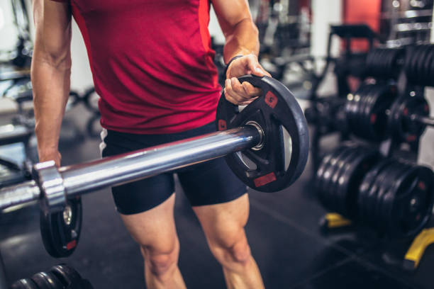 istock Young handsome man doing exercises in gym 1656597560