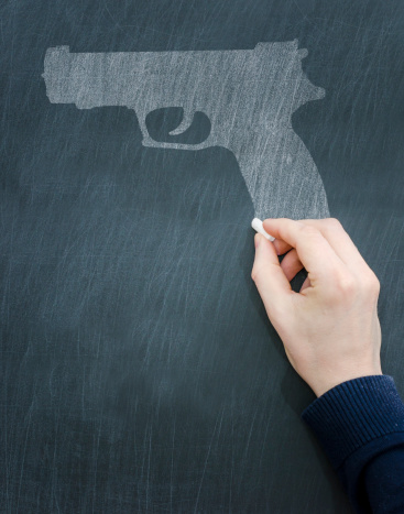 concept on a chalkboard: crime in school, school shooting, massacre ...