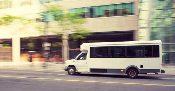 shuttle bus passenger van speeding in downtown toronto