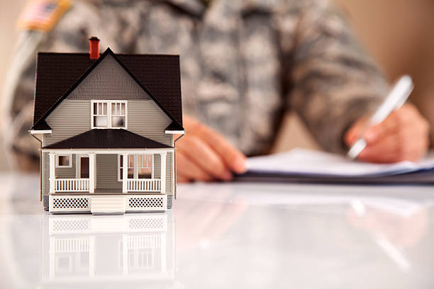 istock Uniformed Personel with Real Estate Paperwork 165661700