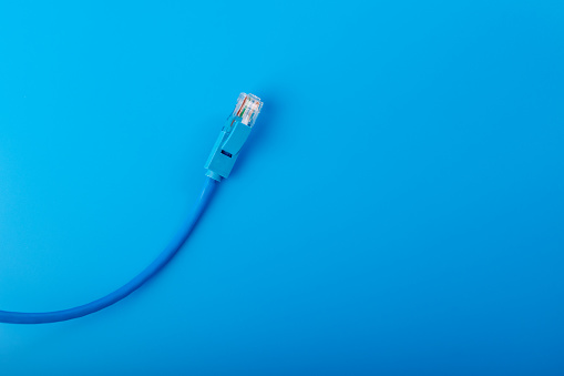 ethernet cable, digital communication, wired connection, blue background