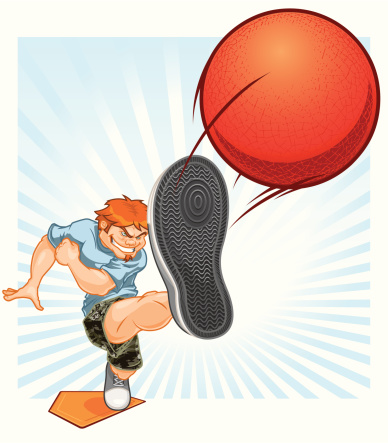 A guy in camo shorts playing kickball