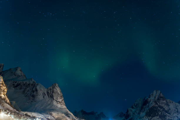 istock Aurora borealis dancing behind and over mountains on Lofoten islands 1656698717