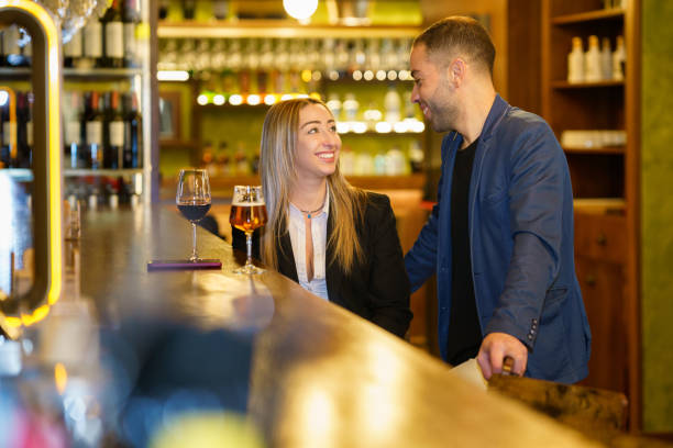 istock Happy diverse couple spending time in pub 1656727550