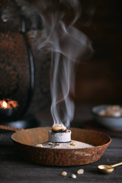 istock Incense resin (olibanum) burning on a glowing incense charcoal 1656729133