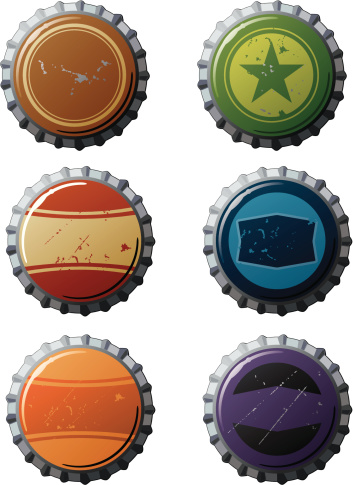 Weathered Soda and beer bottle caps. 