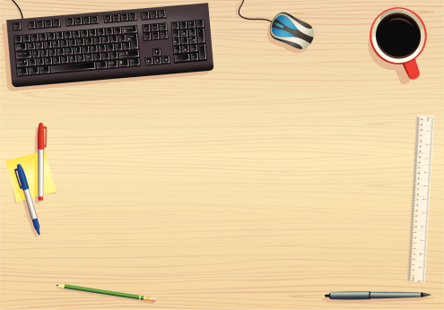 Vector of a typical office work desk. Plenty of space in the middle for your own elements. Desk illustration includes; computer keyboard and mouse, coffee cup, pens, pencils and ruler.