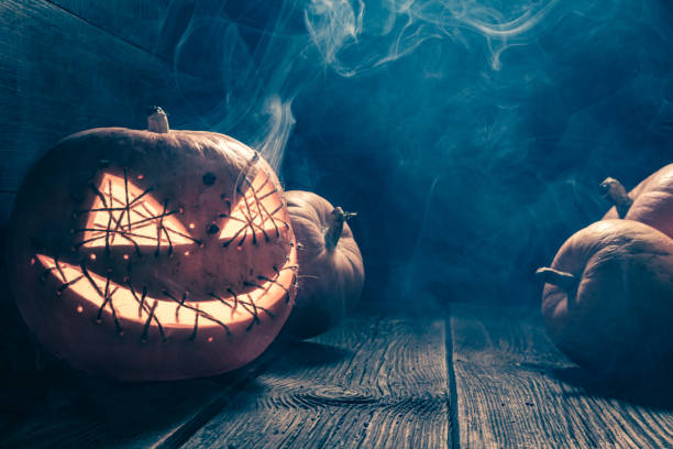 istock Misty and spooky Halloween pumpkin with light and smoke. 1656762033